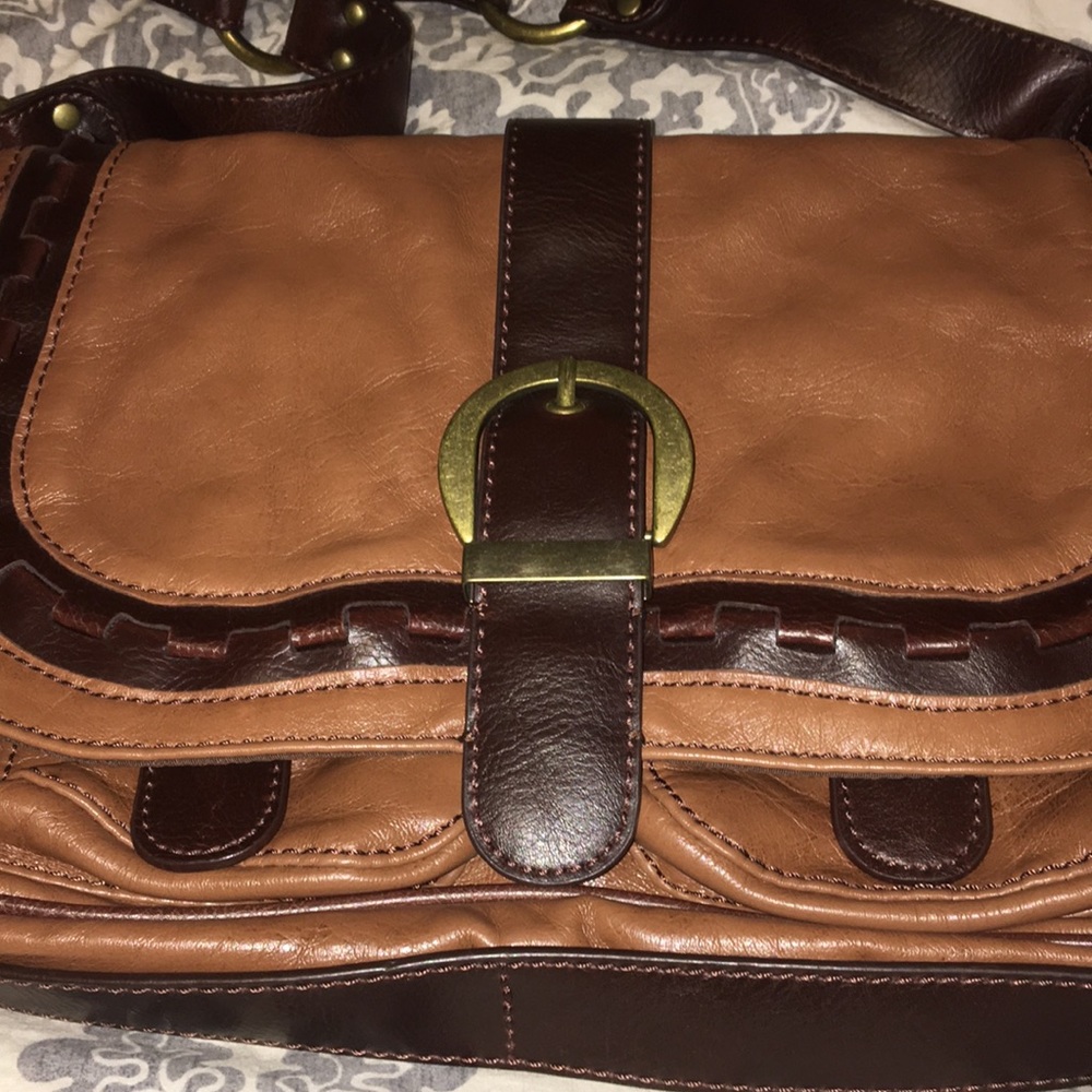 Faux leather shoulder bag with buckle detail.